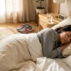 Person sleeping on their side as a natural way to reduce sleep apnea