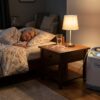 Home oxygen concentrator running continuously beside a bed at night